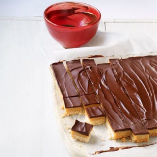 <p>Caramel sandwiched between crunchy cookie and smooth chocolate — it's no wonder that reader Annie Abdai has been making these bars for more than 40 years.</p>
<p><b>Recipe: <a href="http://gogonow.org/recipefinder/chocolate-caramel-candy-bars-recipe-wdy0213%22%3EChocolate Caramel Candy Bars</a></b></p>