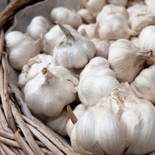 <p>Your favorite flavor-booster can last two to three months in a cool, dry area. Unlike some vegetables, whole garlic is best stored in the pantry in a mesh bag; it depends on airflow for freshness, says Christy Shatlock, RD, of BistroMD. Once you break the bulb, though, store the cloves in an airtight container in the fridge, and use them within a week to catch them before they spoil. </p>