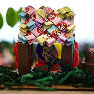 <p>Inside the chicken coop is something special. One of the chicks laid a giant Cadbury egg! It takes up almost the entire Kit Kat and Twizzler coop so the chickens have moved their other nests out into the sunny grass.</p>