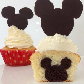<p> Disney-fy a birthday with this vanilla cupcake with a Mickey shaped brownie in the middle! This cupcake will be a hit for Disney and Non-Disney fanatics alike!</p>
<p><strong>Recipe:</strong> <a href="https://www.howtocookthat.net/public_html/mickey-mouse-cupcakes-with-mickey-inside/"><strong>Mickey Mouse Cupcake with Mickey inside</strong></a></p>