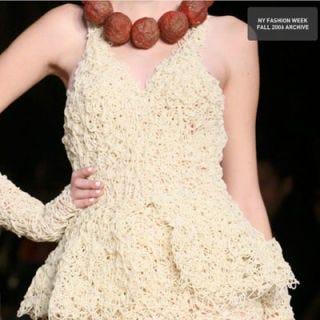 <b>Creator:</b> American fashion designer <a href="http://www.bing.com/search?q=Jeremy+Scott&qs=n&sk=&sc=8-12&form=delish" target="_blank">Jeremy Scott</a><br /><b>Delicious Details:</b> As part of his fall 2006 collection, cleverly titled "<a href="http://www.bing.com/search?q=%22Jeremy+Scott+Food+Fight%22&qs=n&sk=&sc=1-25&form=delish" target="_blank">Food Fight</a>," Scott, known for his wacky themes, playfully paired a spaghetti dress with — what else? — a meatball necklace. It's certainly a conversation piece! <br /><br /><b>Bing:</b> <a href="http://www.bing.com/images/search?q=%22Jeremy+Scott+Food+Fight%22&qpvt=%22Jeremy+Scott+Food+Fight%22&FORM=delish" target="_blank">See other "Food Fight" creations</a> <br /><b>Search:</b> <a href="http://www.bing.com/videos/search?q=Jeremy+Scott&view=detail&mid=720FB3D6F7A0E9FE0EC6720FB3D6F7A0E9FE0EC6&first=0&FORM=delish" target="_blank">Watch Jeremy Scott talk about his 2010 collection</a> <br /><br />Prefer your meatballs for dinner? Try this recipe: <a href="/recipefinder/supersize-meatballs-in-marinara-sauce-recipe-743ab582-592f-4fb7-ba763ce4e4fab430" target="_blank"><b>Supersize Meatballs in Marinara Sauce</b></a>
