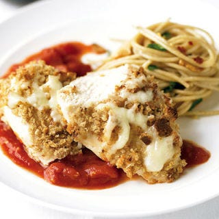 <p>The secret to this healthier baked version of an Italian classic: the breading — only one side of the chicken has it; plus, whole-wheat bread subs in for white. A 10-minute homemade marinara sauce makes this dish special.</p><br /><p><b>Recipe:</b> <a href="/recipefinder/light-chicken-parmesan-recipe" target="_blank"><b>Light Chicken Parmesan</b></a></p>