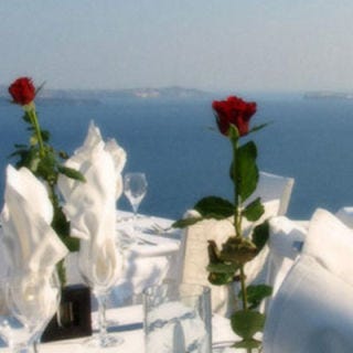 Take in breathtaking views of an ancient volcanic caldera and the Aegean Sea from the terrace of <a href="http://www.restaurant-ambrosia.com/about/" target="_blank">Ambrosia Restaurant</a>, one of the most sought-after eateries in Santorini, in the fabled Greek islands. Get a romantic table for two and feast on Mediterranean and modern Greek cuisine. Sample local Greek wines and enjoy a memory to last a lifetime.