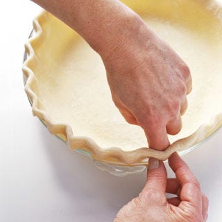 Spotlight on Pie Dough <p><b>Just Chill: </b>Once dough comes together, form into discs, wrap tightly in plastic wrap, and chill for at least 30 minutes. The gluten will have time to rest, which yields a more tender crust.</p>
<p><b>Easy-as-Pie Dough Transfer Method:</b> To easily and cleanly transfer your dough to the pie plate, place the rolling pin near the edge of the dough round farthest from you. Then roll the dough towards you back onto the rolling pin, so that the dough round is loosely wrapped around the pin. Carefully place the dough-wrapped pin over the pie plate on the side nearest you and unroll the dough by moving the pin away from you.</p>
<p><b>Pictured Recipe:</b> <a href="/recipefinder/easy-pie-crust-mslo0410-recipe" target="_blank"><b>Easy Pie Crust</b></a></p>
