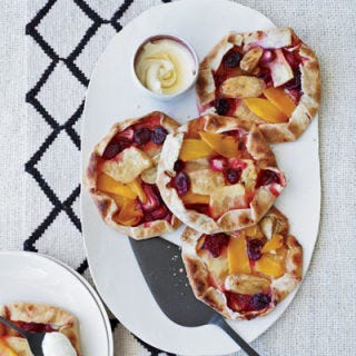 Best Baking Practices <p>To compensate for cool spots in the oven, always rotate your baking sheets halfway through baking. If two pans or baking sheets are in the oven at the same time, switch the pans from the top rack to the bottom and vice versa and turn each pan 180 degrees.</p>
<p><b>Special Tips for ...</b></p>
<p><b>Brownies: </b>Spread batter uniformly in pan before baking, so that the entire batch bakes evenly.</p>
<p><b>Cakes: </b>The center rack is best for cakes. Fill cake pans no more than 1/2 to 2/3 full to promote even baking and rising. If a cake rises too much in the middle, there is no shame in carefully slicing off the protruding top to create a level surface for frosting and decorating.</p>
<p><b>Cookies: </b>To speed up the baking process, line baking sheets with aluminum foil, parchment paper, or silicone mats. While the first batch of cookies is in the oven, you can prep the next batch on a new sheet of foil or parchment paper. This allows you to quickly transfer the cooked cookies to a wire rack and the next unbaked batch onto the baking sheet. To cool cookie sheet between batches, run the sheet under cool water and dry thoroughly.</p>
<p><b>Pictured Recipe:</b> <a href="/recipefinder/free-form-pineapple-mango-berry-tarts-recipe-fw0511" target="_blank"><b>Free-Form Pineapple, Mango, and Berry Tarts</b></a></p>