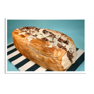 <b>Bakery:</b> <a href="http://www.bing.com/search?q=Confetti+Cakes%2C+New+York&qs=n&sk=&sc=2-24&form=delish" target="_blank">Confetti Cakes</a>, New York, NY<br /><b>Cake Challenge:</b> Jersey Shore sandwich. If we didn't know better, we'd think this Philly cheese steak was the real deal. This meat is actually dyed sugar dough dusted to look like sliced steak. The cheese? Thinned-out royal icing. <br /><br /><b>Bing:</b> <a href="http://www.bing.com/images/search?q=philly+cheese+steak&qpvt=philly+cheese+steak&FORM=delish" target="_blank">Photos of Philly's signature sandwich</a> <br /><b>Search:</b> <a href="http://gogonow.org/search/fast_search_recipes?current_page=2&search_term=royal%20icing" target="_blank">How to make royal icing</a> <br /><b>Find:</b> <a href="http://gogonow.org/search/fast_search_recipes?search_term=royal+icing" target="_blank">Royal icing recipes</a>