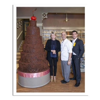 <b>Bakery:</b> <a href="http://www.bing.com/search?q=Pastry+Chef+Alain+Roby%2C+Chicago&qs=n&sk=&sc=1-31&form=delish" target="_blank">Pastry Chef Alain Roby</a>, Chicago, IL<br /><b>Cake Challenge:</b> Top Martha. Behold, the tallest cake in <a href="http://www.bing.com/search?q=The+Martha+Stewart+Show&qs=n&sk=&sc=8-23&form=delish" target="_blank"><i>The Martha Stewart Show</i></a> history. The breakdown: 350 pounds of butter, 12 gallons of buttermilk, 240 pounds of sugar, and 1,900 eggs! Total weight? A whopping 1,250 pounds. <br /><br /><b>Bing:</b> <a href="http://www.bing.com/search?q=%2bhow+to+make+a+tall+cake&FORM=delish" target="_blank">How to make a tall cake</a> <br /><b>Shop:</b> <a href="http://www.bing.com/shopping/search?q=cake+pans&p1=&form=delish&aq=cake+pans&aid=&ct=&qs=n&pq=cake+pans&sp=&rt=Completions&tk=&spv=&sl=E&sc=&st=&ast=AAAAAAAA" target="_blank">Cake pans</a>
