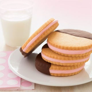 <p>A match made in heaven: two irresistible sugar cookie layers held together by a rich, creamy marshmallow center. A final dip in chocolate sauce makes this cookie an indulgent treat.<p><br/>

<p><b>Recipe: </b><a href="/recipefinder/sweetheart-sandwich-cookies" target="_new">Sweetheart Sandwich Cookies</a></p>