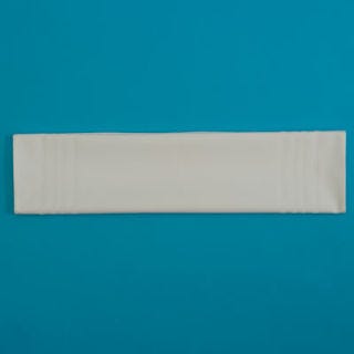 Fold the napkin in half again, to form a long rectangle.