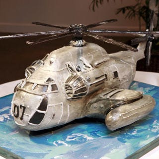 <b>The Bakers:</b> <a href="http://cakelava.com/" target="_blank">cakelava</a>, Kailua, HI<br />
<b>The Challenge:</b> Make a clean cake that passes military standards for perfection.<br />
<b>Fun Fact:</b> This surprise groom's cake was the spitting image of the groom's daily mode of transportation: a CH 53 
Delta helicopter.<br />