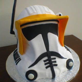 <b>The Bakers:</b> <a href="http://www.cindascreativecakes.com/" target="_blank">Cinda's Creative Cakes</a>, Holly Springs, NC<br />
<b>The Challenge:</b> Re-create a cartoon character that a groom and his son will both love.<br />
<b>Fun Fact:</b> This stormtrooper has a chocolate interior. In fact, 90% of Cinda's groom's cakes are chocolate, 8% are red velvet, and just 2% are carrot.<br />