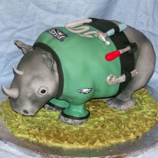 <b>The Bakers:</b> <a href="http://www.cakesbysuzy.com/" target="_blank">Cakes by Suzy</a>, Philadelphia, PA<br />
<b>The Challenge:</b> Make a Mr. Fix-It rhino who loves the Eagles.<br />
<b>Fun Fact:</b> Want a piece of that nose? You may get more rice cereal treat than cake!<br />