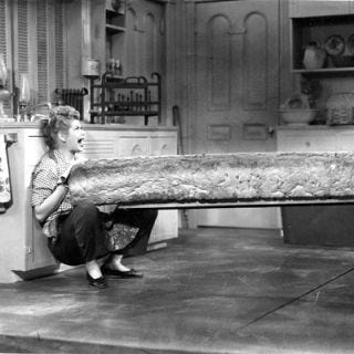 <p><a href="http://www.bing.com/search?q=Lucy+Ricardo+&qs=n&sk=&sc=8-13&form=delish" target="_blank">Lucy Ricardo</a> was definitely no <a href="http://www.bing.com/search?q=Martha+Stewart&go=&qs=n&sk=&sc=8-14&form=delish" target="_blank">Martha Stewart</a>. But in her uptown Manhattan apartment, she had a sizable and well-equipped kitchen. Built for the modern cook, the '50s kitchen featured beautiful two-tone cabinetry and a dinette where she and Ethel spent more time scheming than cooking.</p><br /><p><a href="http://www.bing.com/videos/search?q=I+love+lucy+theme&view=detail&mid=90281E4A2EE8EFA279C090281E4A2EE8EFA279C0&first=0&FORM=delish" target="_blank">Watch the opening theme</a></p><br /><p><a href="http://www.bing.com/videos/search?q=I+love+lucy+show+ethel+filterui%3aduration-short&view=detail&mid=63908F6274788D283BD263908F6274788D283BD2&first=21&FORM=delish" target="_blank">Watch Lucy and Ethel in the kitchen</a></p><br /><p><a href="http://www.bing.com/celebrities/overview/search?q=lucille+ball&id=ee611348-be72-1520-028a-f6e8508e6d59&qpvt=lucille+ball&FORM=delish" target="_blank">More on Lucille Ball</a></p><br /><p><a href="http://www.bing.com/videos/search?q=lucille+ball&view=detail&mid=F839A3FC0053606F2A51F839A3FC0053606F2A51&first=0&FORM=delish" target="_blank">Watch her interviewed by Dick Cavett</a></p><br /><p><a href="http://www.bing.com/images/search?q=50s+interiors&qs=n&sk=&sc=4-12&form=delish" target="_blank">Photos of '50s décor</a></p>