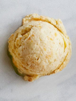 <p>Cook 2 1/2 cups diced fresh peaches and 1/4 cup sugar in a saucepan until softened; cool completely. Stir 6 ounces crumbled goat cheese and 2 teaspoons peach schnapps into prepared gelato before chilling in step 2. Swirl cooked peach mixture into prepared gelato before freezing in step 3.</p>