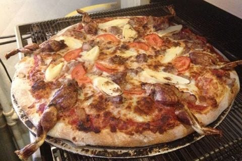 <p>There's a pizzeria in Fort Myers, Fla., that thought it would be a great idea to round-up the local wildlife and eat them all… on a pizza! Named "The Everglades," Evan's Neighborhood Pizza apparently combines the swamp animal trifecta of python, alligator, and frogs on their unique pizza offering. </p>