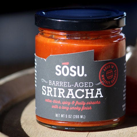 <p>After the long srirachapocalypse scare, we're still as in love with it as before. We know you douse every savory meal with it, and that's ok, as long as you're ready to accept that the ultra-popular sauce can and has been improved. <a href="http://www.sosusauces.com/" target="_blank">Sosu Sauces</a> is taking sriracha to a new level by aging it in oak whiskey barrels for 3 months, imparting the simple four-ingredient sauce with a smokey depth that will mercilessly hook you. Act fast, though, the 3-month-aged version is limited edition.</p>
<p><em>SOSU Barrel-Aged Sriracha; $25 for an 8 oz jar; <a href="https://www.kickstarter.com/projects/657999288/sosu-barrel-aged-sriracha" target="_blank">buy here</a></em></p>