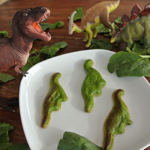 Cute as a button, these adorable dinosaur-shaped quiches get their green color from healthy spinach — and in this form, the kids are sure to eat it right up.