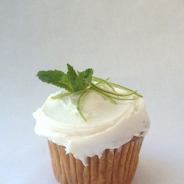 <p>TIP: Replace vanilla extract with bourbon for frosting that packs a punch.</p> <p>Simmer 1 cup each <strong>water</strong> and <strong>granulated sugar</strong>, 1 bunch <strong>fresh mint</strong> and 1 piece <strong>lime peel</strong> in small saucepan over medium heat, stirring, 5 minutes or until sugar dissolves. Remove from heat; let stand 10 minutes. Then strain into a liquid measuring cup through a fine-mesh sieve.</p> <p>Make your favorite <strong>vanilla cupcakes</strong>, from scratch or a mix (I love the yellow cake recipe in the <em><a href="http://www.amazon.com/Good-Housekeeping-Great-Baking-Pastries/dp/1588165930?tag=ghk_autolinks-20" target="blank">Good Housekeeping Great Baking</a></em> cookbook)! While cupcakes are still warm, poke with a toothpick and brush with the mint simple syrup. Make our favorite <a href="http://www.goodhousekeeping.com/recipefinder/vanilla-cream-cheese-frosting-1482" target="blank">cream cheese frosting recipe</a>, replacing 1 teaspoon <strong>vanilla</strong> with <strong>bourbon</strong>. Frost cupcakes once cool. Garnish with <strong>mint leaves</strong> and thinly sliced <strong>lime peel</strong>.</p>
