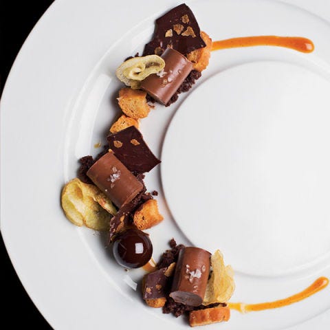<p><strong>Chocolate crémeux, $13</strong><br /><span>Pastry chef Sarah Jordan presents chocolate in three ways in one dessert: as a silky </span><em>crémeux</em><span>, a flourless chocolate cake and a caramel-filled chocolate sphere. Candied crouton pretzels, Goose Island beer caramel and briny potato chips further intensify the flavor and add texture. "This was intended to have everything that is bad for you—beer, chocolate, chips and pretzels," says Jordan, who is celebrated for her fun, whimsical style. "I wanted to present all of these simple comforts in an elegant plated dessert that was interesting to eat."</span><em><a title="Boka" href="http://www.bokachicago.com/" target="_blank">bokachicago.com</a></em></p>