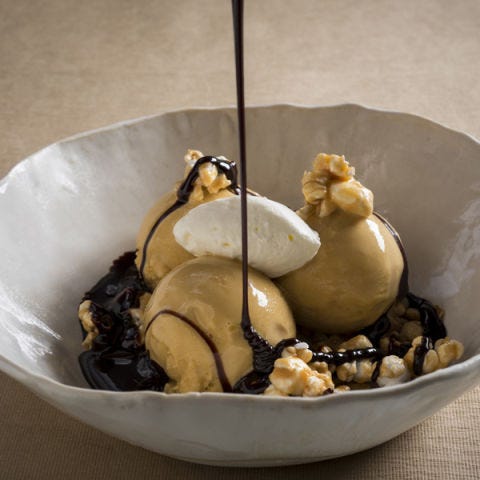 <p><strong>Salted caramel ice cream sundae, $14</strong><br /><span>Jean-Georges Vongerichten and chef Dan Kluger run this acclaimed farm-to-table spot off Union Square. It's home to one of the city's cult sundaes. "It's like a deconstructed Snickers bar with salt," Vongerichten says. With a nod to the candy bar flavor profile, pastry chef Melody Lee's sweet-and-savory take on a classic sundae is transcendent, bringing together scoops of sea salted–caramel ice cream in a pool of rich chocolate fudge, garnished with crushed peanuts, whipped cream and a scattering of crunchy caramel-coated popcorn.</span><em><a title="ABC Kitchen" href="http://www.abchome.com/abc-kitchen" target="_blank">abchome.com/abc-kitchen</a></em></p>