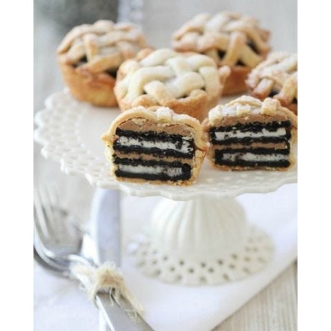 <p>Pumpkin and chocolate cupcakes combine the classic colors and flavors of Halloween.</p> <p><strong>Get the recipe from <a href="http://picky-palate.com/2011/07/13/oreo-and-peanut-butter-layered-baby-lattice-pies/" target="_blank">Picky Palate</a>.</strong></p>