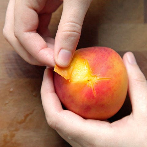 <p>Gently peel the peaches by pulling at the skin or rubbing it off gently with the side or pad of your thumb. The skin should come off easily; if it does not, simmer the peaches slightly longer, chill them down, and try again.</p><p>Your peaches are now ready to be pitted, sliced, and added to a cobbler, tart, or whatever your heart desires. This method also works well for nectarines, plums, and tomatoes.</p>