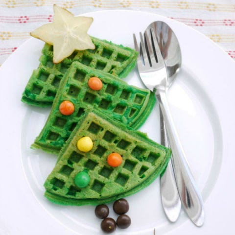 <p>Let the kids decorate your delicious Christmas tree waffles with candy ornaments of their choosing.</p> <p><strong>Get the recipe from <a href="https://crustabakes.wordpress.com/2012/12/19/christmas-tree-waffles/" target="_blank">Crustabakes</a>.</strong></p>