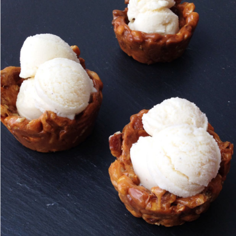 <p><strong>Crunchy Nut Bowls</strong><br /> Spray jumbo muffin tins with cooking spray. In 3-quart saucepan, heat 1 cup sugar, 1/3 cup water, and 1/4 cup light corn syrup to boiling on medium-high, stirring. Cook until amber. Stir in 2 tablespoons butter and1/2 teaspoon baking soda. Remove from heat; quickly stir in 1 1/2 cups mixed nuts, and pour immediately into jumbo muffin tins. Using a rubber spatula, press against the sides of muffin tin, forming a thin bowl. Once completely cool, remove the nut brittle from tin, and fill with ice cream.</p>