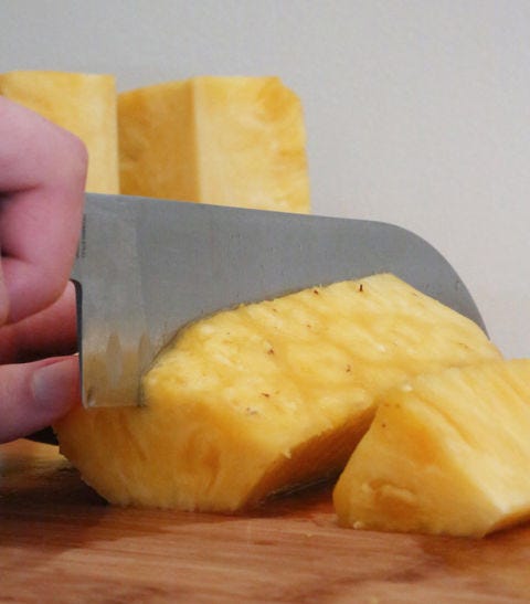 <p>Line up the spears and cut them in half. </p>