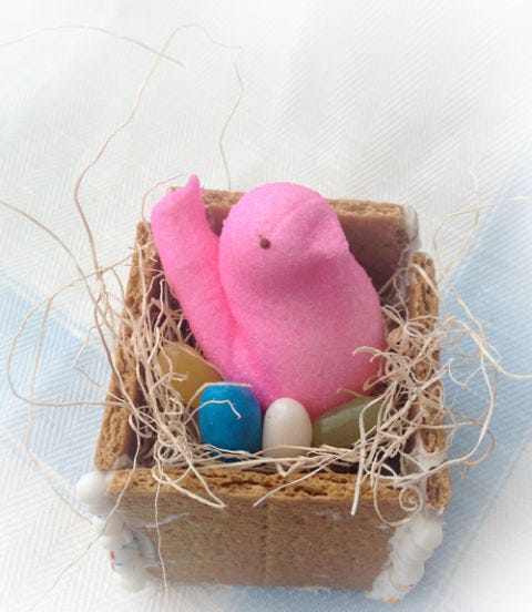 <p><em>To make:</em> Stick together 5 square graham crackers using store-bought vanilla frosting; it'll harden as it dries. Press candy into excess frosting, if desired. Fill with decorative grass, candy and 1 marshmallow chick. Add a small card or colorful Post-It with your guests' names for a personal touch.</p> <p><em>PS:</em> You can use a marshmallow bunny, and turn this into a "rabbit hole!" Mix and match both ideas at your Easter table.</p>