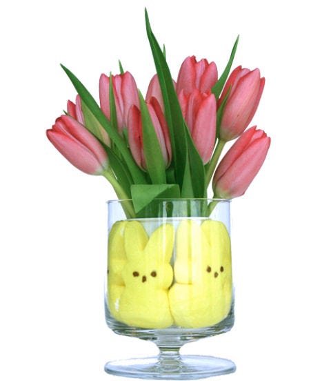 <p><em>To make:</em> Press 4 to 5 marshmallow bunnies around the edge of a wine, water or parfait glass. Insert a small cup in the center of the glass, fill with water and add your favorite flowers.</p>