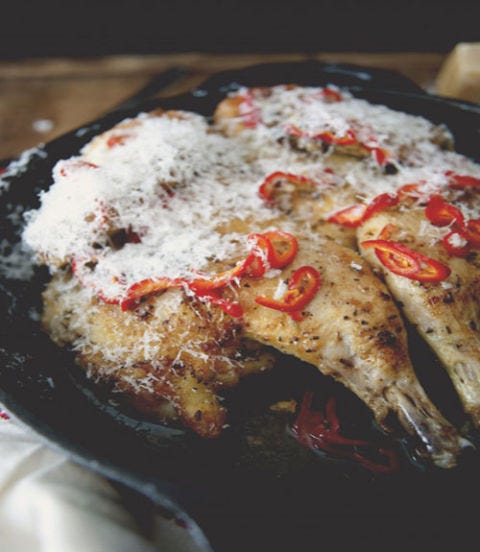 <p>Skip the fried chicken tonight and opt for a healthier version, garnished with chili peppers. </p> <p><strong>Recipe:</strong> <a href="http://www.thekitchykitchen.com/?recipes=/pollo-al-mattone-with-pickled-chilies-parmigiano/" target="_blank">Pollo Al Mattone With Pickled Chilies & Parmigiano</a></p>