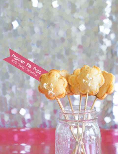 <p></p>
<p><strong>Get the recipe from <a href="http://www.sugaryandbuttery.com/2013/07/popcorn-pie-pops-with-salty-caramel.html" target="_blank">Sugary and Buttery</a>.</strong></p>