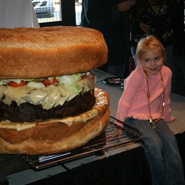 As tall as a toddler and heavier than a full-grown human, the world's largest burger is available for purchase at Mallie's Sports Bar in Southgate, MI.