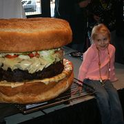 As tall as a toddler and heavier than a full-grown human, the world's largest burger is available for purchase at Mallie's Sports Bar in Southgate, MI.