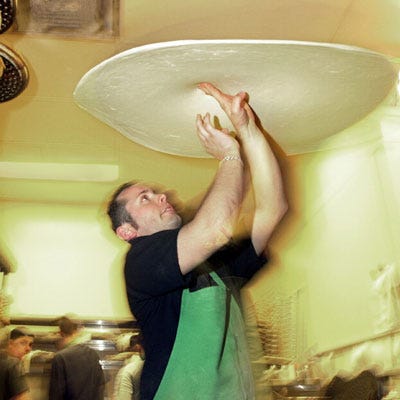 <b>Record Holder: Tony Gemignani</b>

<p>Location: Mall of America, Minneapolis, Minnesota</p>

<p>April 20, 2006</p>

<p>Pizza-wielding hotshot Tony Gemignani spun 17.6 ounces of dough for 2 minutes to form a pizza crust whose diameter topped out at 33.2 inches. Gemignani spun for the gold as part of the Food Network's Guinness World Records Week.</p>

