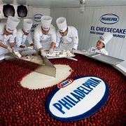 Topped with strawberries and yielding 20,000 slices, the world's biggest cheesecake was created by a team of pastry chefs in Mexico City.