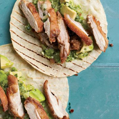 <p>"Right in Tijuana's red-light district sits Kentucky Fried Buches, where cooks fry chicken necks, skin on, to fill soft corn tortillas. I can't stop eating them," says Andrew Zimmern. "At home, I fry skin-on chicken thighs until they're supercrisp, then eat them with avocado-tomatillo salsa, my family's favorite."</p><p><b>Recipe: </b><a href="/recipefinder/fried-chicken-tacos-recipe-fw0511" target="_blank"><b>Fried Chicken Tacos</b></a></p>