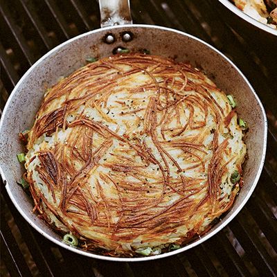 <p>This skillet-size hash brown was inspired by a side dish at Madison, Wisconsin's Tornado Steakhouse. Slicing potatoes lengthwise on a mandoline makes for long, dramatic-looking strands; you can also julienne the potatoes in a food processor.</p><p><strong>Recipe:</strong> <a href="http://www.delish.com/recipefinder/tornado-hash-brown-recipe-fw0814"><strong>Tornado Hash Brown</strong></a></p>