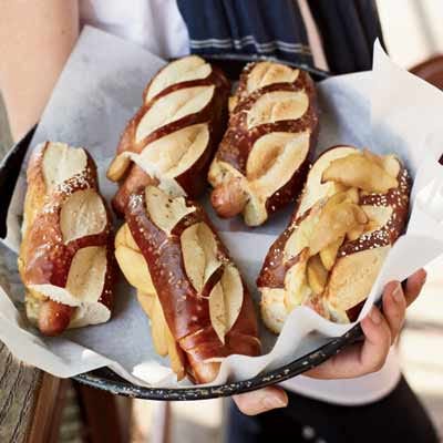 <p>Here is a terrific, if unlikely, combination of cinnamony sautéed apples with slices of sharp cheddar cheese, served on top of hot dogs tucked into pretzel rolls.</p><p><b>Recipe:</b> <a href="http://gogonow.org/recipefinder/hot-dogs-cheddar-sauteed-apples-recipe-fw0910%22 target="_blank"><b>Hot Dogs with Cheddar and Sautéed Apples</b></a></p>