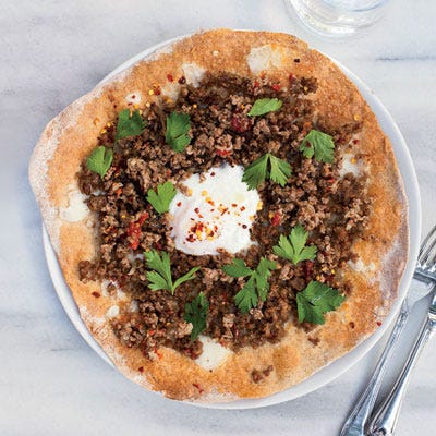 <p>At her takeout shop in Istanbul, Kantin Dükkan, Semsa Denizsel tops her pizzas with ground lamb (flavored with sweet sun-dried tomatoes and a little spicy red pepper), but you can substitute ground beef instead.</p>
<p><b>Recipe: </b><a href="/recipefinder/turkish-ground-lamb-pizzas-recipe-fw0512" target="_blank"><b>Turkish Ground-Lamb Pizzas</b></a></p>