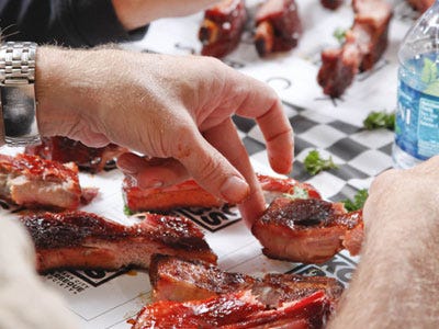 Jack Daniel's World Championship Barbecue Invitational <p>Looking for a big, huge, classic barbecue cook-off to hit this summer? Look no further than the Jack Daniel's World Championship Invitiational Barbecue. Now in its 24th year, this event in the heart of barbecue country has good barbecue down to a science. The 2011 Invitational brought 71 U.S. teams, along with 18 international teams, to Lynchburg, Tennessee, also home to the Jack Daniel's distillery. Affectionately referred to as "The Jack" by locals and longtime attendees (about 25,000 are expected this year), allows competitors to test their skills in seven different categories: pork ribs, pork shoulder/butts, beef brisket, chicken, dessert, cook's choice, and Jack Daniel's sauce, and the winners are awarded $30,000 in cash and prizes. Aside from the barbecue, other attractions include live music and performances of the traditional dance of the Appalachian region, clogging.</p><p><a href="http://www.jackdanielsbarbecuemedia.com/" target="_blank">Jack Daniel's World Championship Invitational Barbecue</a>.</p>