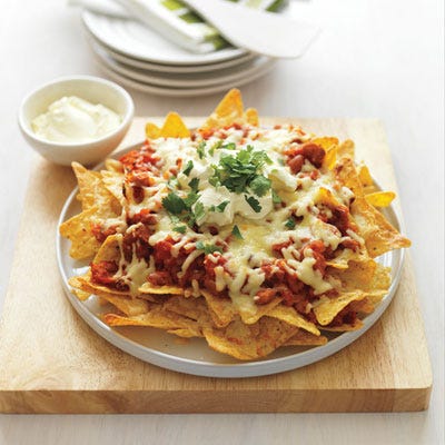 <p>Serve nachos straight from the oven so the corn chips remain crunchy and the cheese is nice and oozy.</p><p><b>Recipe:</b> <a href="http://gogonow.org/recipefinder/veggie-nachos-recipe-del0512%22%3E%3Cb%3EVeggie Nachos</b></a></p>
<p><strong>Related: <a href="http://gogonow.org/recipes/cooking-recipes/how-to-make-nachos%22 target="_blank">Cheesy, Must-Dig-In Nacho Recipes</a></strong></p>