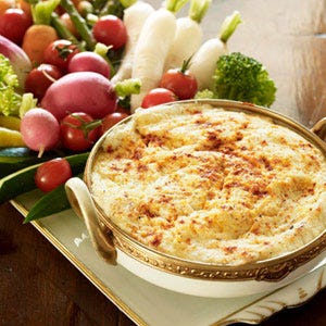 Delaware: Crab Dip <p>Crabbing has long been a popular activity on the Delaware beaches. Since Delaware's entire Eastern side borders the Atlantic, there's plenty of room for people to use crab pots and traps to catch Blue Crabs to cook for dinner. American recipes for crab dip date back to the early 19th century. While some suggested cooking methods mirror a modern day clam bake, many recipes were created to extend the crab meat. Mayonnaise and cream cheese were often added to the meat during World War II so it could serve more people. Nowadays Delaware crab dip can be served hot or cold. The former is baked in the oven like a casserole; the latter is simply thrown together and eaten immediately.</p>
<p><b>Make It:</b> <a href="/recipefinder/hot-crab-dip-recipe"><b>Hot Crab Dip</b></a></p>
<p><b>Order It:</b> Fenwick Crab House has its own special recipe for hot crab dip. The restaurant boasts that many imitators have attempted to copy the dish without success. The cheesy dip is baked in a French Boule Roll and finished with fresh cheddar cheese that melts over top.</p>
<p><i>Fenwick Crab House; 100 Coastal Highway, Fenwick Island, City; (302) 539-2500; <a href="http://www.fenwickcrabhouse.com" target="_blank">fenwickcrabhouse.com</a></i></p>