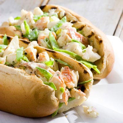 <p>Ah, New England: Nantucket, Walden Pond, and lobster rolls! Lobster rolls are a staple of Maine cuisine. They are also available at seafood restaurants in the other New England states and on Eastern Long Island, where fishing is common. However, lobster is amazing in Maine and more expensive than in other parts of the country, making it a treat if you're visiting the state. Traditionally served with butter (as opposed to mayonnaise), lobster rolls from Maine are usually served on a split hot dog roll and prepared with cold lobster meat. You'll find potato chips and a dill pickle on the side, giving you a bit of a luxurious "fast-food" lunch.</p>

<p><b>Make It:</b> <a href="/recipefinder/grilled-lobster-rolls-recipe-5535"><b>Grilled Lobster Rolls</b></a></p>

<p><b>Order It:</b> Are you heading to Maine this summer? Do yourself a favor and stop by Five Islands Lobster Co., located in a fishing village on the island of Georgetown. According to the lovely folks at Five Island, the surrounding waters are some of the coldest and deepest along this stretch of Atlantic coast, making it ideal for perfect, highly sought after lobster. From their waters to your plate, just like that.</p>

<p><i>Five Islands Lobster Co.; 1447 Five Islands Rd., Georgetown; (207) 371-2990; <a href="http://www.fiveislandslobster.com/" target="_blank">fiveislandslobster.com</a></i></p>
