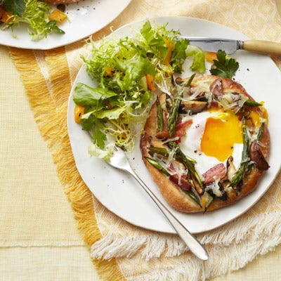 <p>Skip your typical breakfast sandwich and try these mini breakfast pizzas instead. Serve pizzettes with a simple <a href="/recipefinder/escarole-frisee-salad-recipe-ghk0512"><b>Escarole Frisée Salad</b></a> (pictured).</p><p><b>Recipe: <a href="/recipefinder/asparagus-fontina-pizzettes-bacon-recipe-ghk0512">Asparagus-Fontina Pizzettes with Bacon</a></b></p>