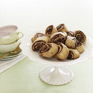 <p>We use a food processor to blend a less sticky dough, eliminating hours of chilling. Instead of rolling the dough into a perfect round and cutting it into wedges (a tough job), we shape an easy rectangle and form it into a log to slice. And we do it all between sheets of waxed paper--saving you cleanup time, too.</p><p><b>Recipe:</b> <a href="/recipefinder/raspberry-rugelach-recipe-ghk1210" target="_blank"><b>Raspberry Rugelach</b></a></p>