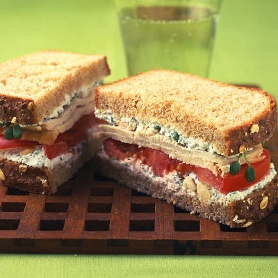 turkey sandwich with herbed farmer cheese  sprouts and tomato