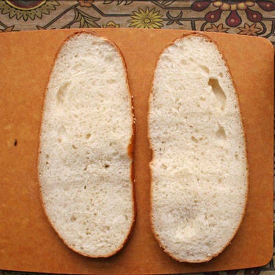 <b>Pluck Out Bread Innards</b>

To make this sandwich more travel friendly, pluck out the bread innards to create a bread bowl, so the sandwich fixings fit snugly inside. Bread lovers, leave the top half of the bread intact and only pluck out the bread from the bottom half.