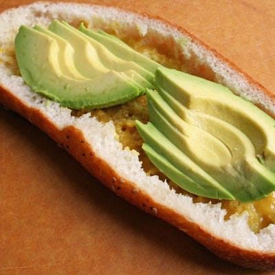 <b>Add the Avocado Slices</b>

Add the avocado to the bottom of the sandwich half (inside the "bread bowl"). If the avocado is less ripe, slice it very thinly and spread the slices across the bread.